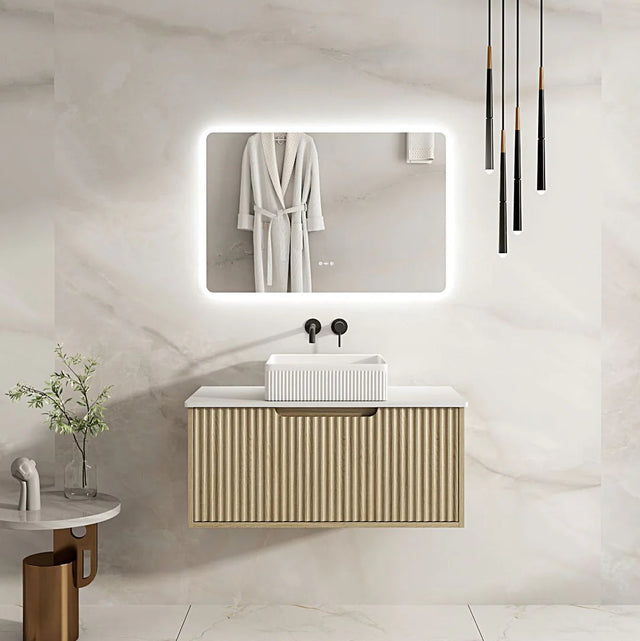 Modern bathroom with a vanity unit, mirror, and hanging robe.