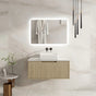 Modern bathroom with a vanity unit, mirror, and hanging robe.
