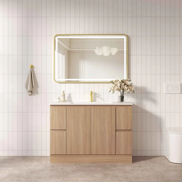 Bathroom vanity with wooden cabinet, mirror, and sink against a tiled wall.