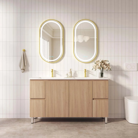 Bathroom vanity with two mirrors and a light fixture on a tiled wall.