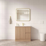 Bathroom with wooden vanity, mirror, and white tiles