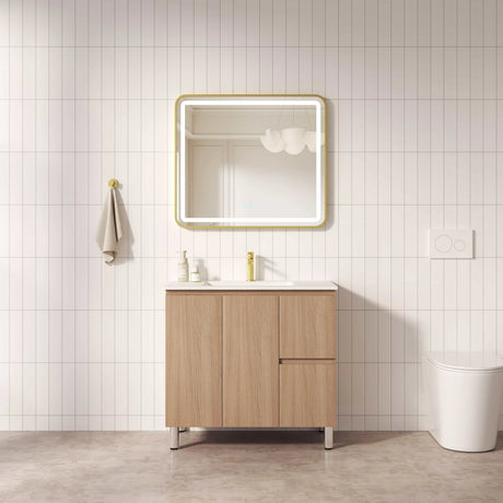Bathroom with wooden vanity, mirror, and white tiles
