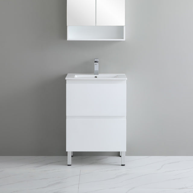 White bathroom vanity with sink against a gray wall
