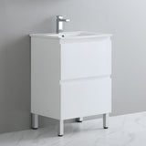 White bathroom vanity with sink and faucet on a gray background