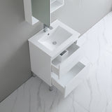 White bathroom vanity with sink in a modern bathroom setting