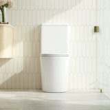 Modern white toilet in a bathroom with geometric tile pattern