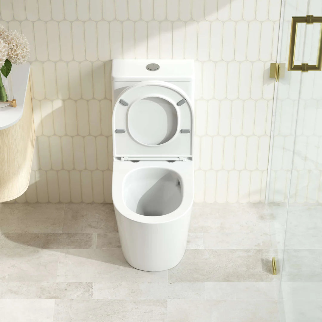 White toilet in a bathroom with tiled walls and floor