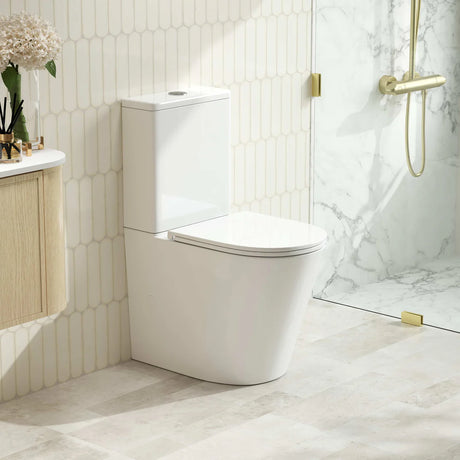 Modern bathroom with a white toilet and marble shower