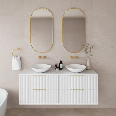 Bathroom vanity with two sinks, mirrors, and decorative elements.
