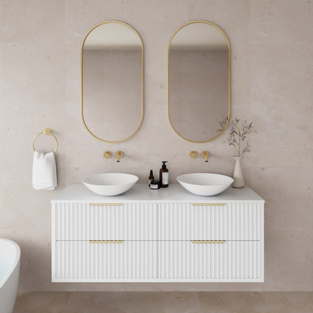 Bathroom vanity with two sinks, mirrors, and decorative elements.