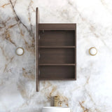 Bathroom setup with wooden cabinet, sink, and marble wall.