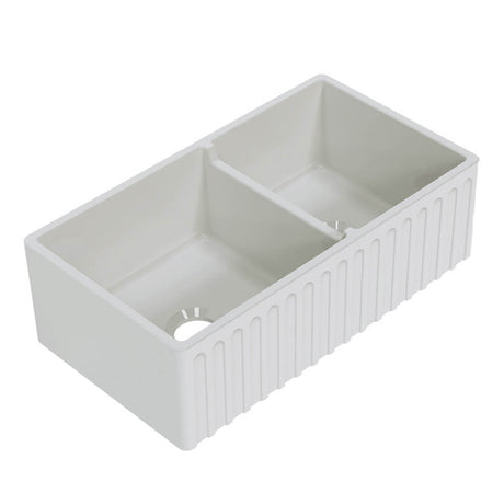 White kitchen sink with a ribbed design on a white background