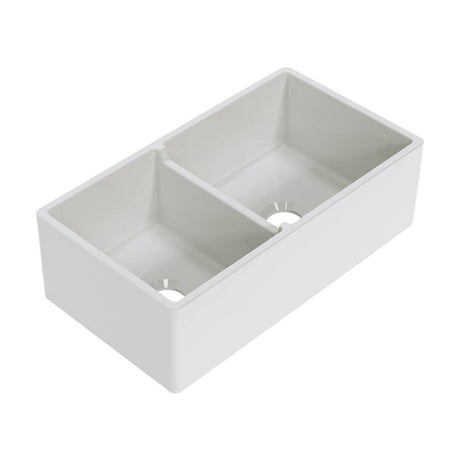 White kitchen sink with a divided basin on a white background