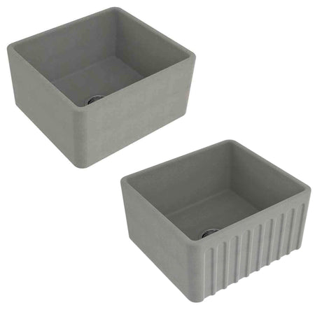 Two gray rectangular farmhouse sinks shown from different angles on a plain white background, one with a smooth interior and one with vertical fluted detailing on the front.