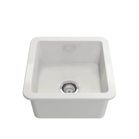 White ceramic kitchen sink on a white background