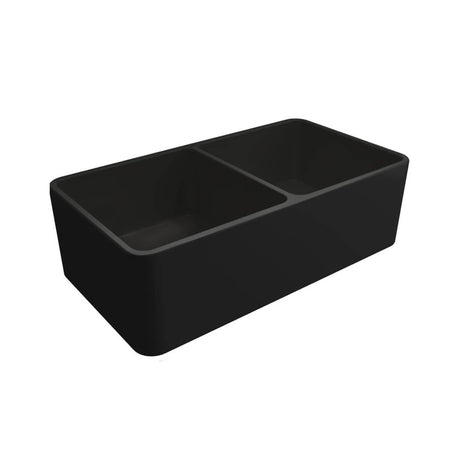 A black double-bowl farmhouse sink with a deep rectangular shape, shown from an elevated angle on a solid white background.