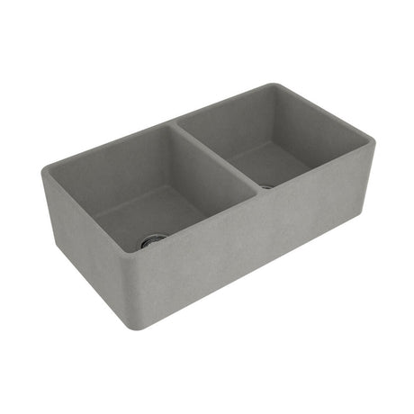 A gray concrete double-bowl farmhouse sink shown from an elevated angle on a plain white background.