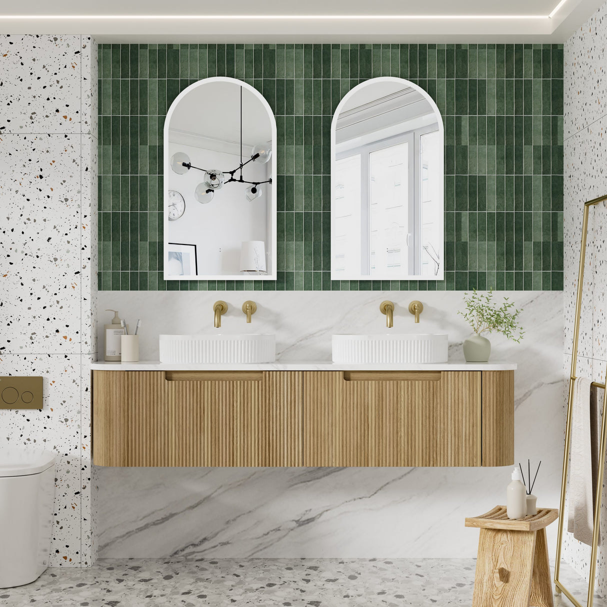 Bathroom with wooden vanity, white sinks, and green tiled wall.