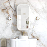 Bathroom with marble wall, white vanity, and mirror