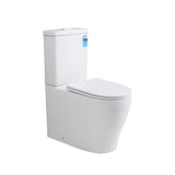A modern white wall-mounted toilet with a closed lid and a small blue sticker on the side of the tank, shown against a plain white background.