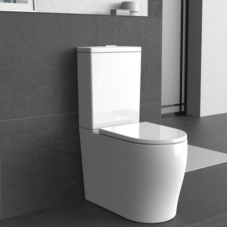 Modern toilet in a bathroom with gray tiles