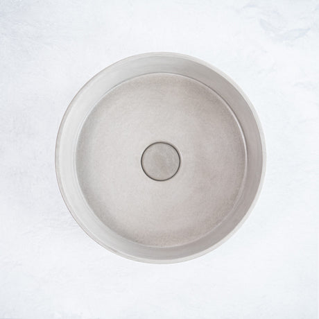 ARLO Round Concrete Basin in Concrete, featuring a smooth circular design with a natural matte finish, ideal for adding a minimalist and modern touch to any bathroom.